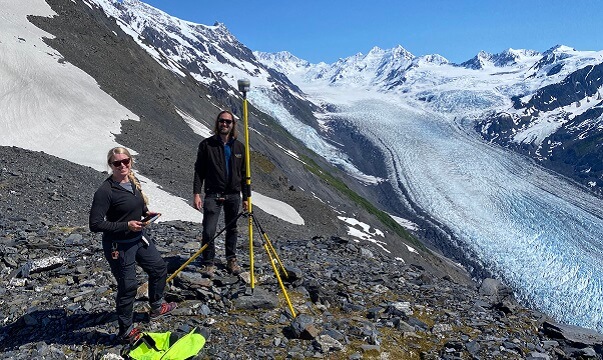 Setting up a GNSS base station on ridge above Barry Glacier